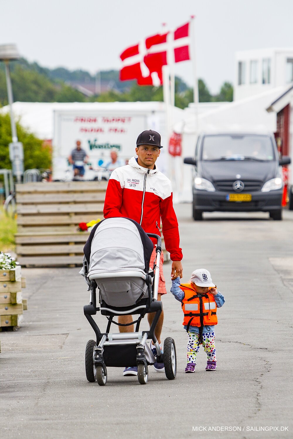Sebastian Ostling with baby Vera while mom, Anna, is out racing in Middelfart 2015